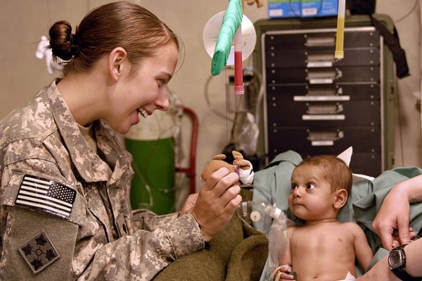 a solider visiting a baby