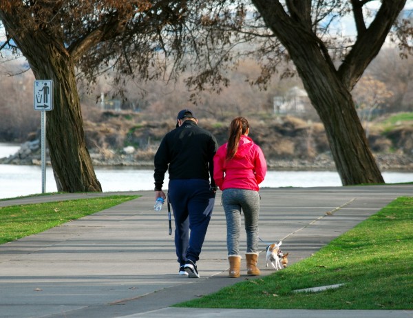 Couple on their morning walk with their dog